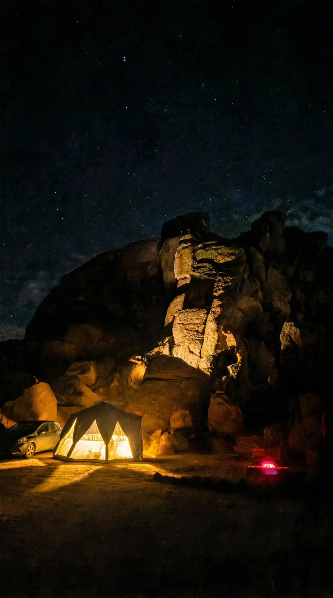 Tent camping under the stars at night